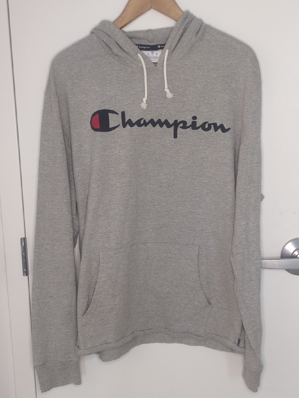 Champion Light Gray Pullover Hoodie with Script Logo and Red Accent